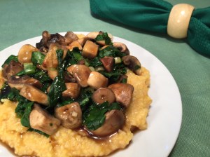 Polenta topped with mushrooms and spinach
