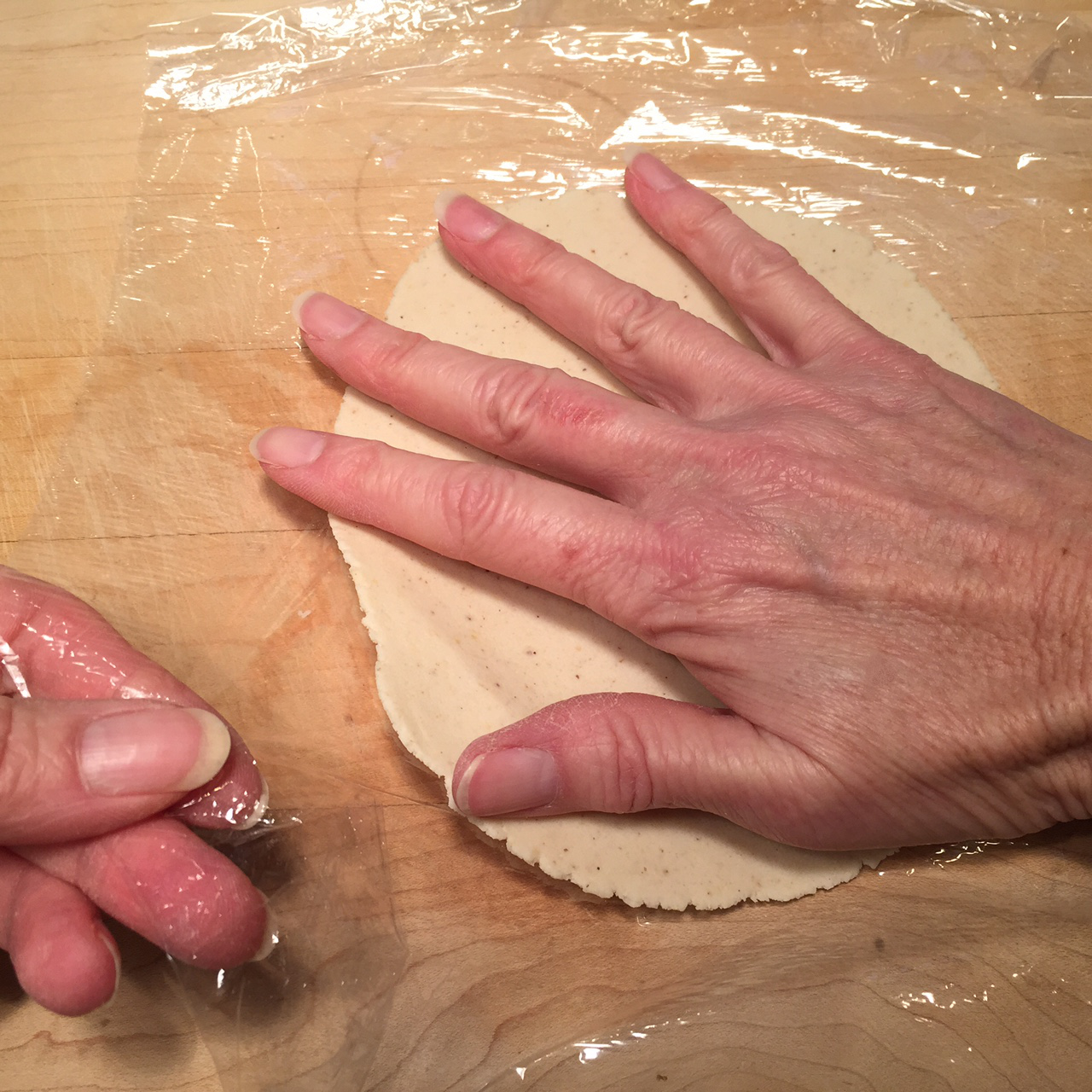 corn tortilla hand on dough